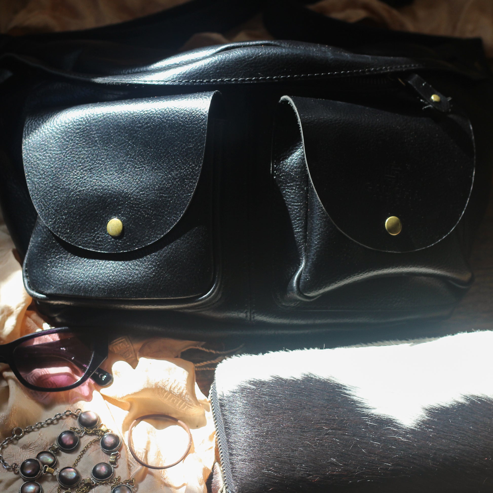cross chest black leather bag